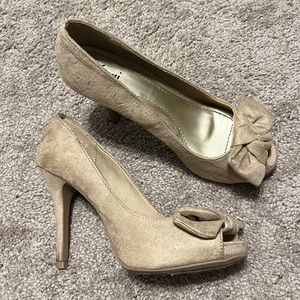 Beige suede heels, with a cute little bow only worn a few times